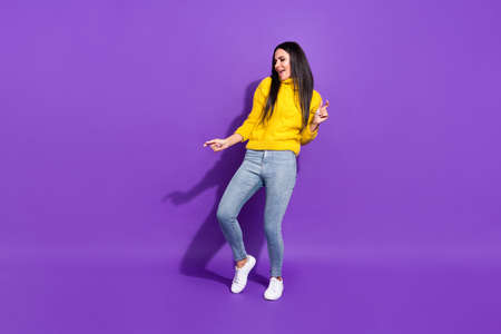 Full length portrait of crazy positive person dancing have good mood open mouth isolated on purple color backgroundの写真素材
