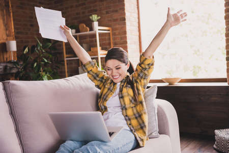 Portrait of excited astonished attractive person raise hands celebrate triumph look netbook toothy...