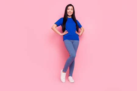 Full length photo of happy charming young woman hold hands waist wear casual clothes isolated on...