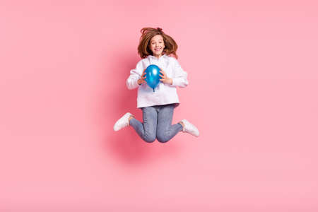 Full length body size view of pretty trendy cheerful girl jumping holding helium decor ball isolated...