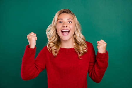 Photo of young girl happy positive smile rejoice victory lucky success fists hands isolated over...