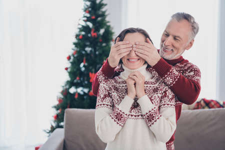 Photo of sweet couple elder lady man close eyes wear sweater at homeの写真素材