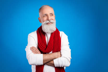 Photo of charming sweet mature man dressed white pullover red scarf hands folded looking empty space...