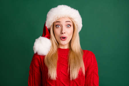 Portrait of attractive cheerful amazed girl festal day eve reaction isolated over green color...