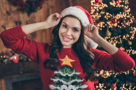 Photo of millennial cute brunette lady wear sweater hat at home alone