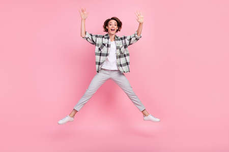 Full size photo of hooray millennial brunette lady jump wear shirt trousers isolated on pink backgroundの写真素材