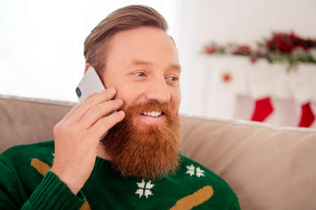Photo of smiling male talk on phone tell news information wish merry christmas happy new year...
