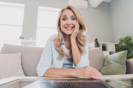 Photo of smiling cheerful attractive businesswoman have online training at home house distance work quarantine lockdownの写真素材