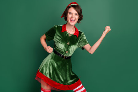 Portrait of attractive cheerful girl having fun rejoicing great success eve day winter isolated over...