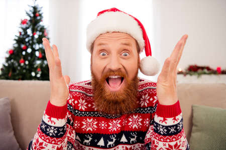 Photo of young man amazed shocked surprised happy positive smile season shopping sale winter holiday indoorsの写真素材