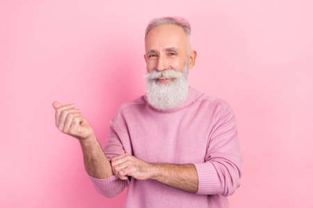 Photo of positive grey hair senior man wear pink sweater isolated on pastel color background