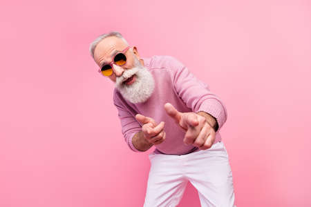 Photo of cool grey beard hair old man point you wear eyewear sweater isolated on pink backgroundの写真素材