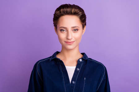 Portrait of young beautiful gorgeous good mood stunning businesswoman with short hair isolated on purple color backgroundの写真素材