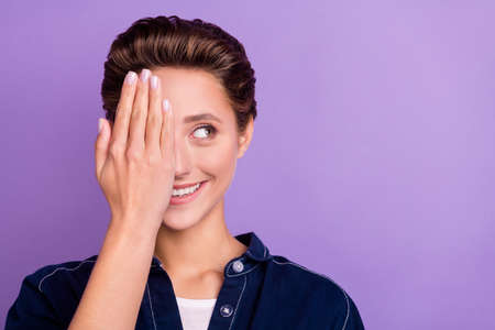 Photo of funny young short hairdo lady close face wear jeans shirt isolated on violet color backgroundの写真素材