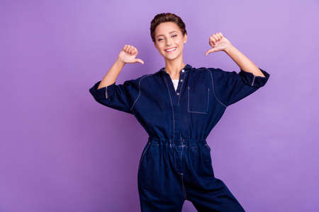 Photo of young pretty good looking cheerful female point finger herself advertise isolated on purple color backgroundの写真素材