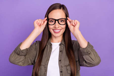 Photo of positive lovely cheerful mature woman wear glasses smiling white teeth isolated on purple...