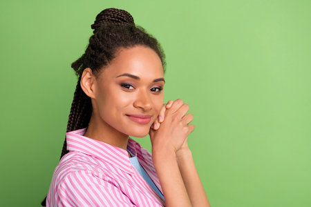 Photo of pretty cute dark skin woman dressed striped shirt arms cheek empty space empty space...