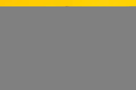 Portrait of attractive cheerful wavy-haired girl giving double thumbup ad isolated over bright yellow color backgroundの写真素材