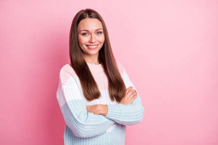 Photo portrait of confident woman folded hands smiling isolated on pastel pink color background with...