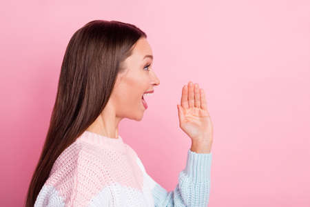 Side profile photo portrait of happy woman shouting telling news looking empty space isolated on...