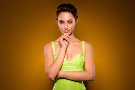 Photo of young attractive charming woman hold hand chin think minded face isolated on gradient backgroundの写真素材