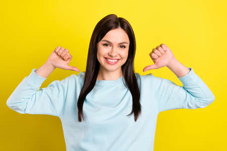 Photo of positive brown hairdo young lady point herself wear blue hoodie isolated on yellow color...