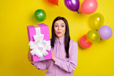 Photo of impressed brown hairdo young lady hold present ballons fly wear birthday hat pink shirt...