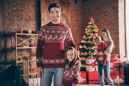Photo of happy positive family christmas spirit tradition good mood indoors inside house home apartmentの写真素材