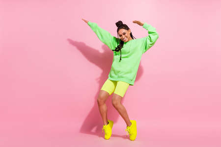 Full size photo of happy nice afro american young woman dance funky mood isolated on pink color...