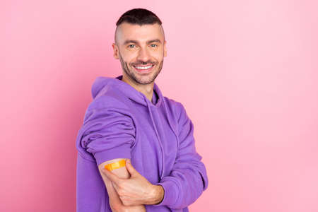 Profile side photo of young guy virus protection plaster stop infection isolated over pink color backgroundの写真素材