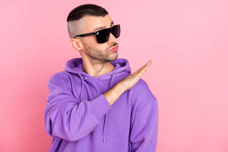 Photo of funky millennial brunet guy look wear eyewear hoodie isolated on pink backgroundの写真素材