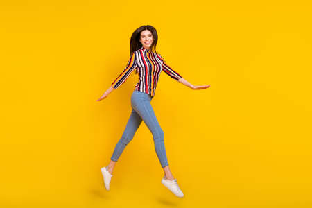 Full body profile side photo of young woman happy positive smile go walk jump up air isolated over...