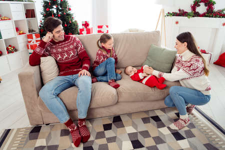 Full body photo of young family happy positive smile sit couch comfort winter holiday december...
