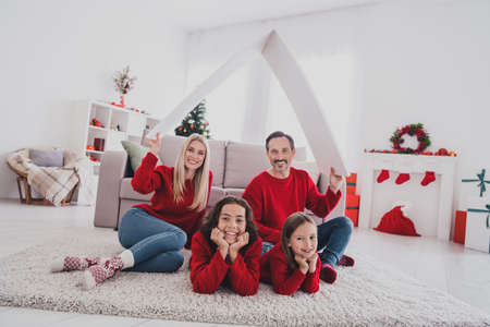Portrait of beautiful handsome wife husband brother sister holding roof credit loan advent buy purchase realestate at home house indoorsの写真素材