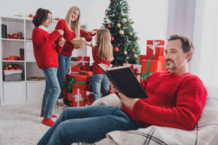 Portrait of handsome beautiful careful adorable family wife husband spending eve time tradition decorating at home house indoorsの写真素材