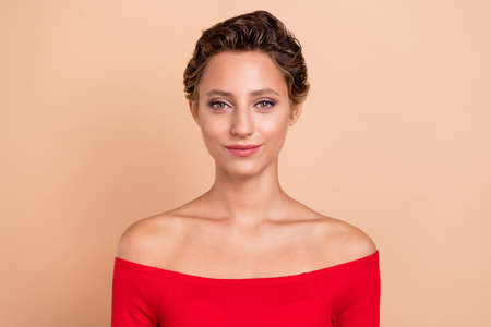 Photo of happy young charming woman smile enjoy rest free time isolated on pastel beige color backgroundの写真素材