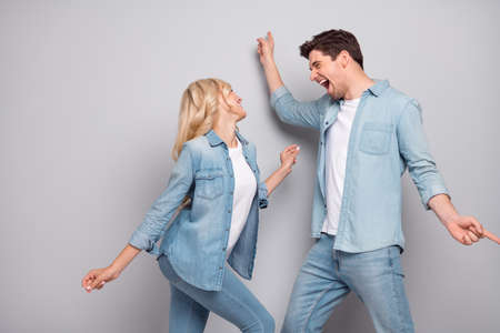 Profile side photo of young couple happy positive smile have fun dance party disco isolated over...