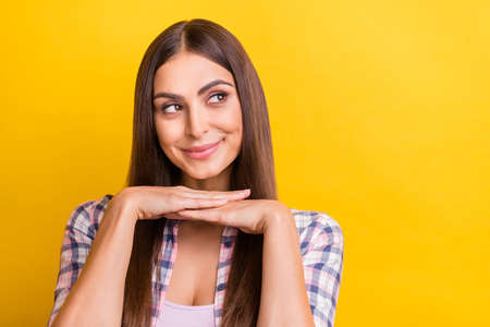 Photo of young attractive woman happy positive smile dream think look empty space isolated over...