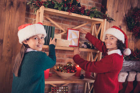 Profile side view portrait of two attractive cheerful siblings preparing decor eve time eve newyear...