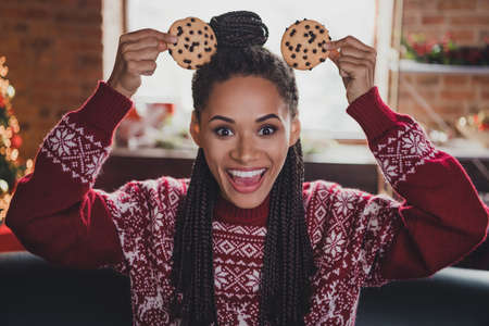 Photo of funny crazy lady make cookie mickey mouse ears have x-mas fun wear jumper in decorated home...