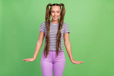 Photo of cute lovely positive young pretty lady cure girlish mood wear casual clothes isolated on...