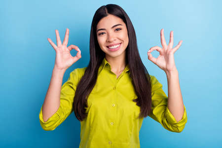 Photo of young korean girl happy positive smile show fingers okay sign perfect great feedback...