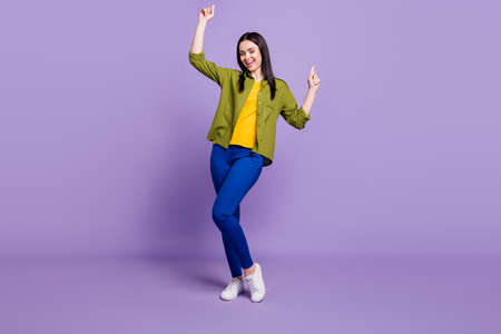 Full length photo of young attractive girl happy positive smile dance club isolated over purple...
