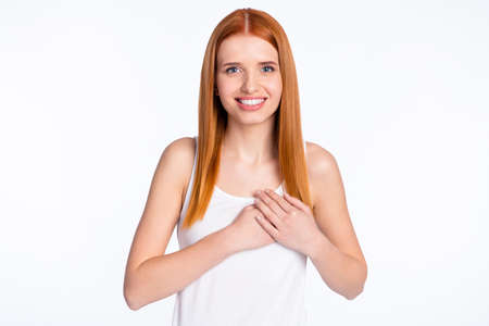 Photo of positive nice red hairdo lady wear white top hands heart isolated on bright color backgroundの写真素材
