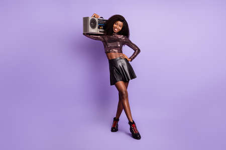 Photo of lady hold recorder hand hip look camera wear glossy shirt mini skirt isolated purple color...