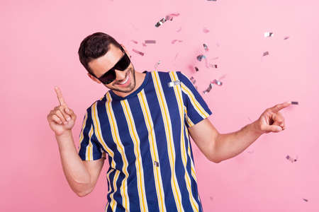 Photo of young brunet guy dance wear t-shirt eyewear isolated on pink color backgroundの写真素材
