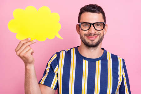 Photo of nice young brunet guy hold mind wear striped t-shirt eyewear isolated on pink color...