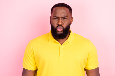 Portrait of attractive confused funky virile guy pout lips isolated over pink pastel color backgroundの写真素材