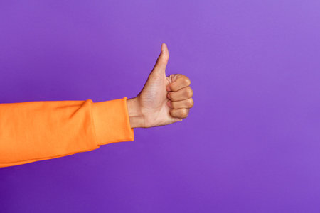 Photo of young african man hand show thumb-up like cool perfect select suggest advertise isolated...