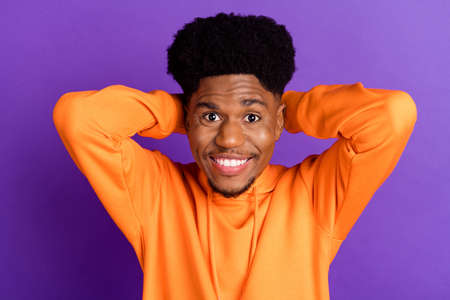 Top above high angle view photo of afro american young man hold hands behind head isolated on violet...
